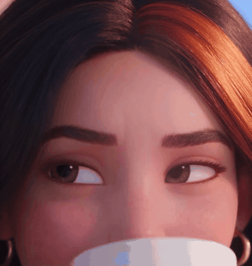 Close-up of her face, less puffy, smiling over her morning coffee